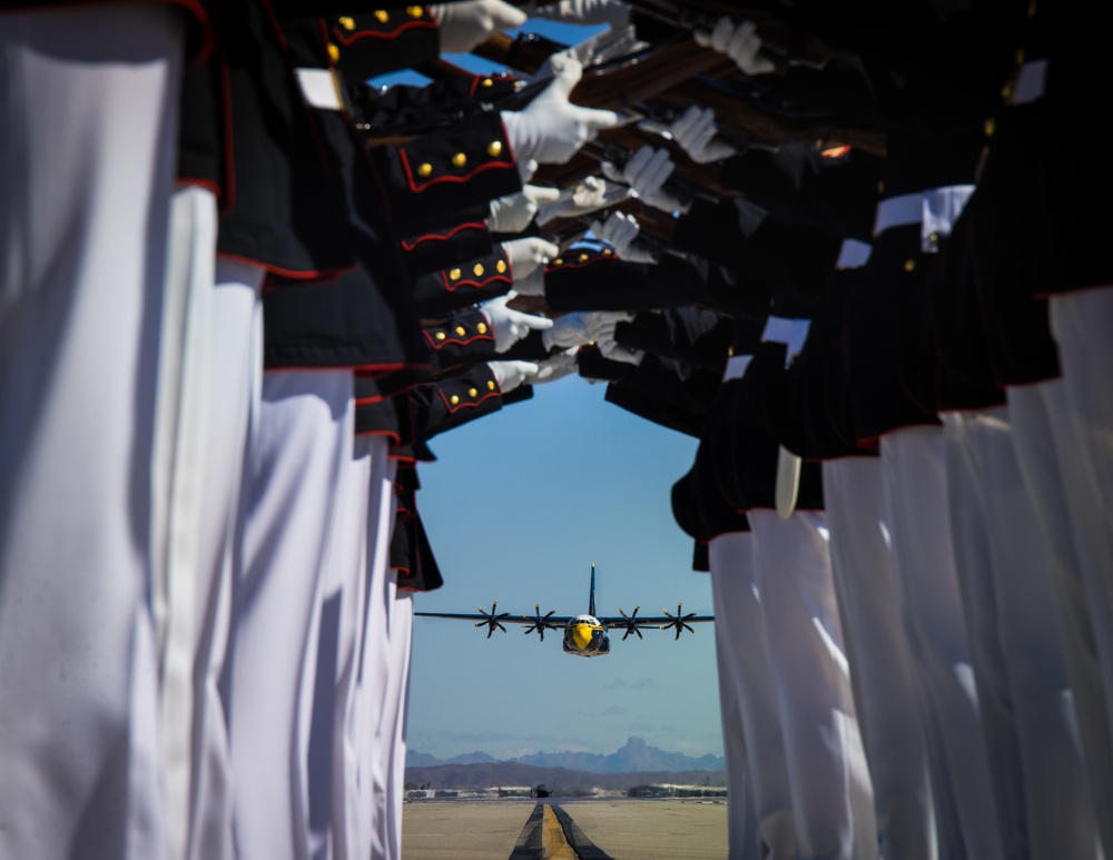 Marines of the Silent Drill Platoon, perform during the Blue Angels’ “Fat Albert” C-130J Super Hercules fly-over at Marine Corps Air Station, Yuma, Ariz.