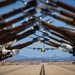 Marines of the Silent Drill Platoon, perform during the Blue Angels’ “Fat Albert” C-130J Super Hercules fly-over at Marine Corps Air Station, Yuma, Ariz.