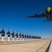 Marines of the Silent Drill Platoon, perform during the Blue Angels’ “Fat Albert” C-130J Super Hercules fly-over at Marine Corps Air Station, Yuma, Ariz.