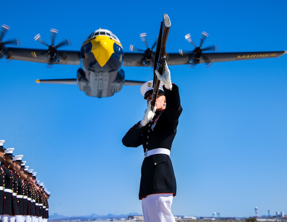 Marines of the Silent Drill Platoon, perform during the Blue Angels’ “Fat Albert” C-130J Super Hercules fly-over at Marine Corps Air Station, Yuma, Ariz.