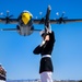 Marines of the Silent Drill Platoon, perform during the Blue Angels’ “Fat Albert” C-130J Super Hercules fly-over at Marine Corps Air Station, Yuma, Ariz.