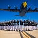 Marines of the Silent Drill Platoon, perform during the Blue Angels’ “Fat Albert” C-130J Super Hercules fly-over at Marine Corps Air Station, Yuma, Ariz.