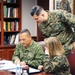 U.S. Marine Corps Col. Reginald J. McClam gives a base tour to the Commandant of the Columbian Marine Corps