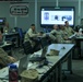 Australian Defense Force - Army Major speaks with U.S. Marines at Marine Corp Logistics Operations Group