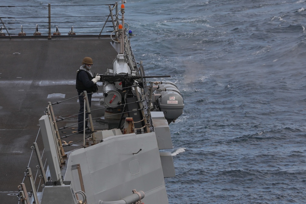 USS Thomas Hudner (DDG 116) conducts a test of its .50 caliber machine guns