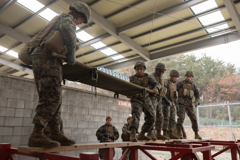 U.S. Marines with 3rd Maintenance Battalion and Republic of Korea Marines maneuver obstacle courses together during Korean Marine Exercise Program