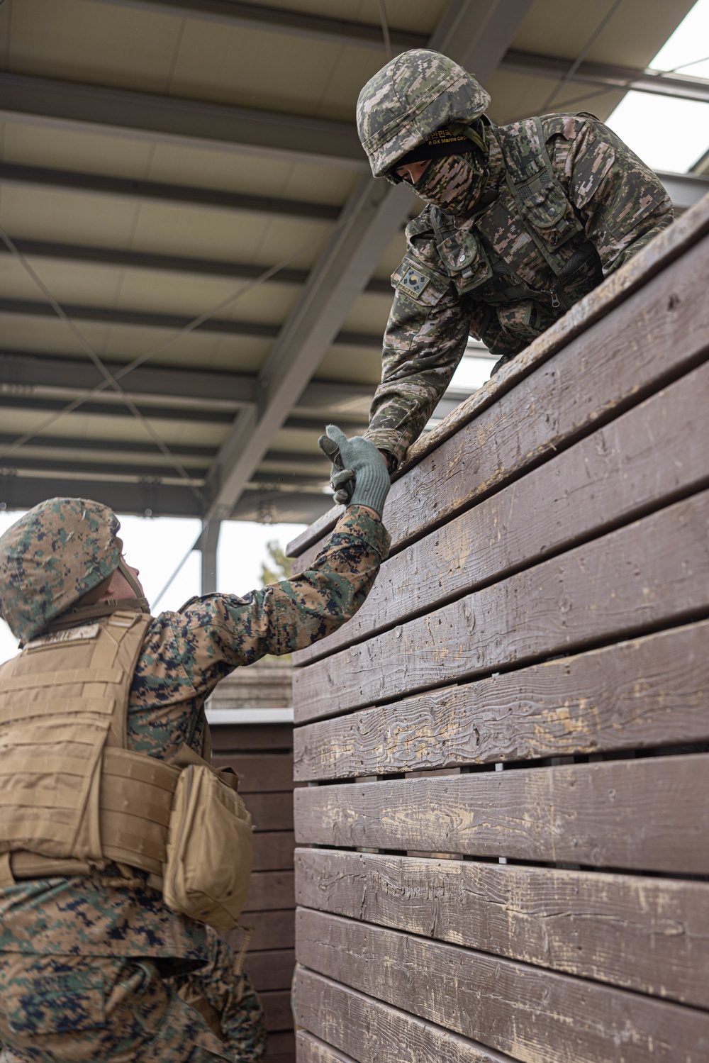 U.S. Marines with 3rd Maintenance Battalion and Republic of Korea Marines maneuver obstacle courses together during Korean Marine Exercise Program