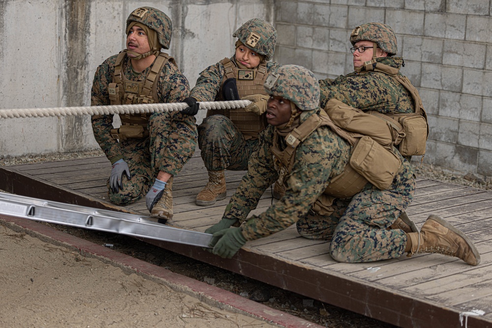 U.S. Marines with 3rd Maintenance Battalion and Republic of Korea Marines maneuver obstacle courses together during Korean Marine Exercise Program