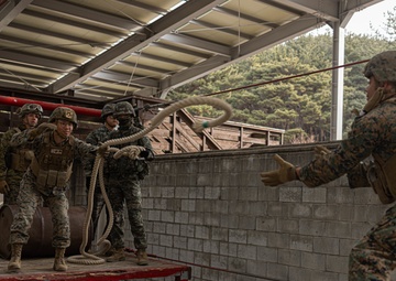 U.S. Marines with 3rd Maintenance Battalion and Republic of Korea Marines maneuver obstacle courses together during Korean Marine Exercise Program