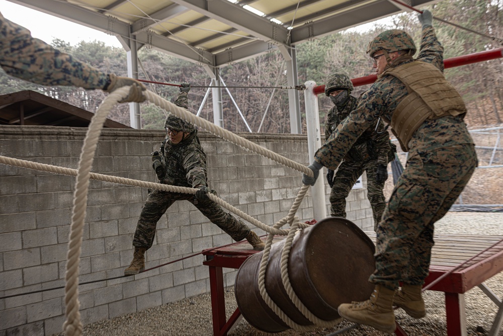 U.S. Marines with 3rd Maintenance Battalion and Republic of Korea Marines maneuver obstacle courses together during Korean Marine Exercise Program