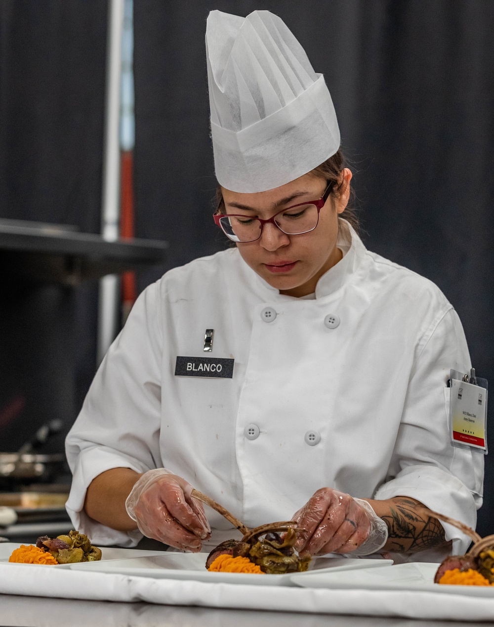 Warrant Officer 1 Daniella Blanco plates her entree