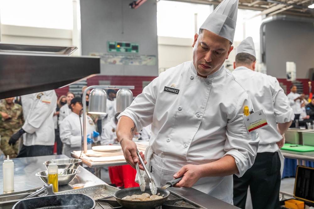 Sgt. Jacob Hernandez cooks scallops