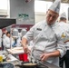 Sgt. Jacob Hernandez cooks scallops