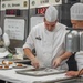 Sgt. Steven Philipps finishes preparing the dessert