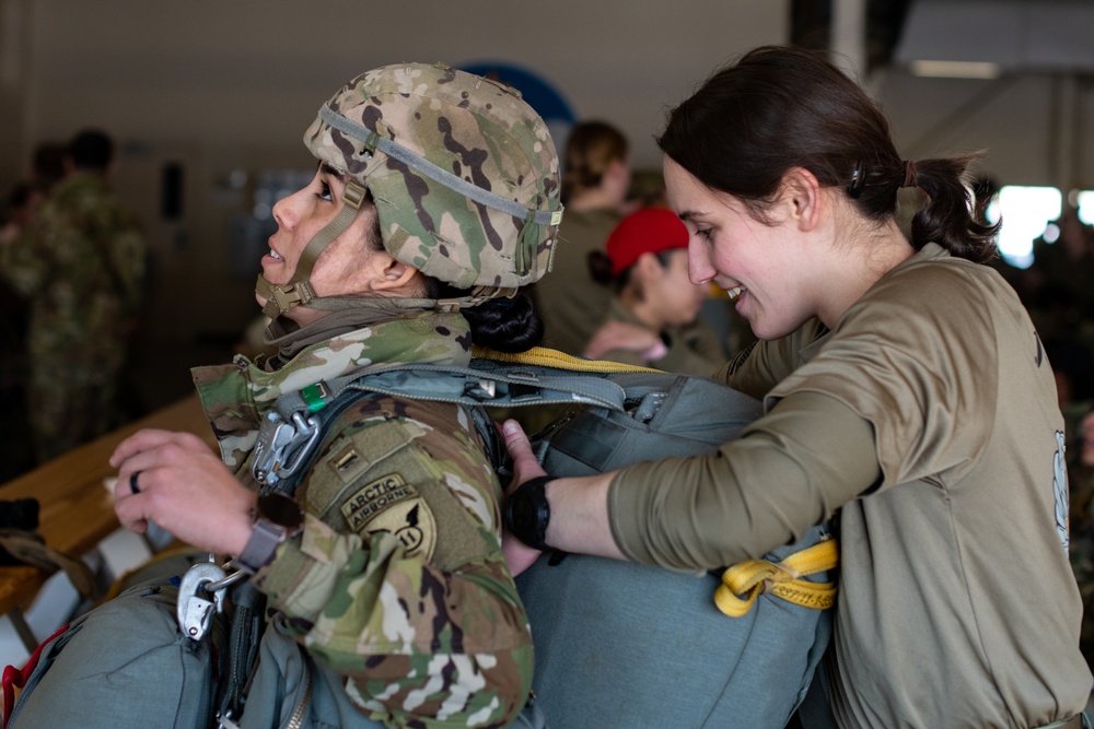 Ladies of 11th Airborne leap during all-women jump