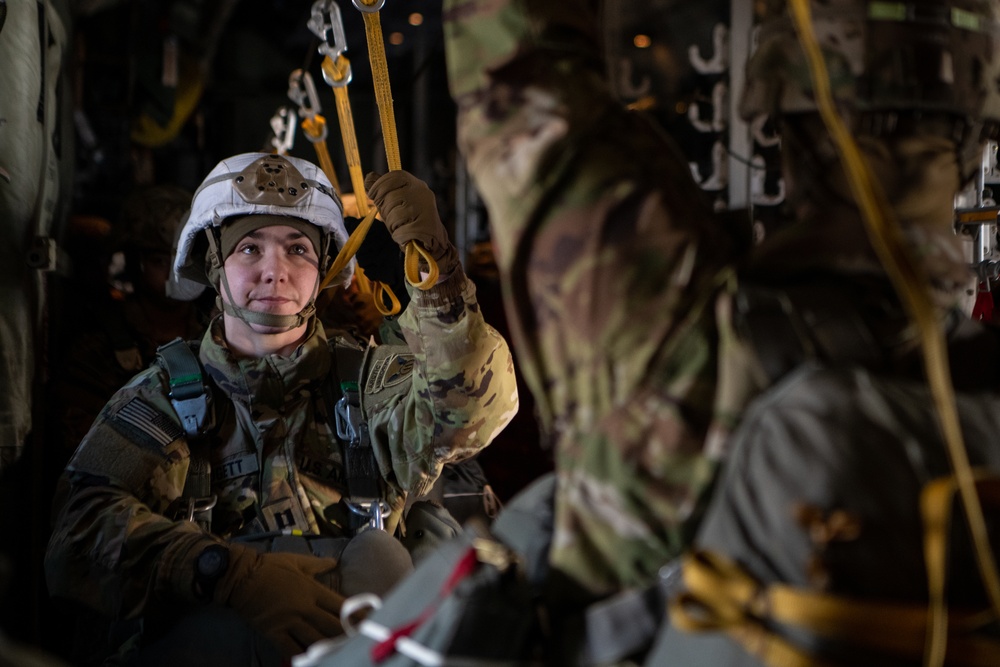 Ladies of 11th Airborne leap during all-women jump