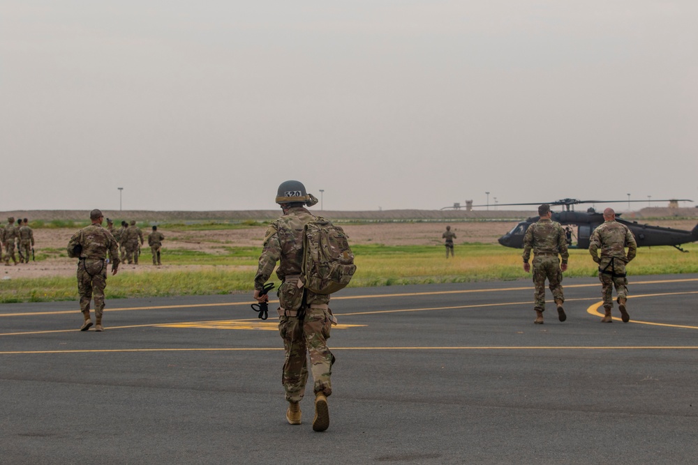 Task Force Spartan Soldiers rappel from Black Hawks during Rappel Master Course