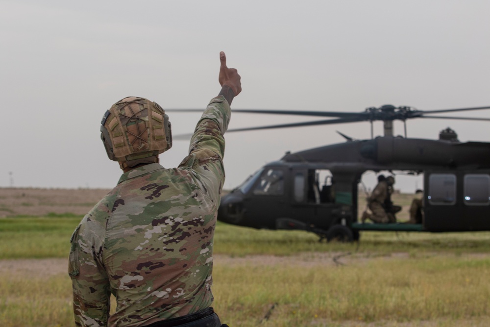 Task Force Spartan Soldiers rappel from Black Hawks during Rappel Master Course