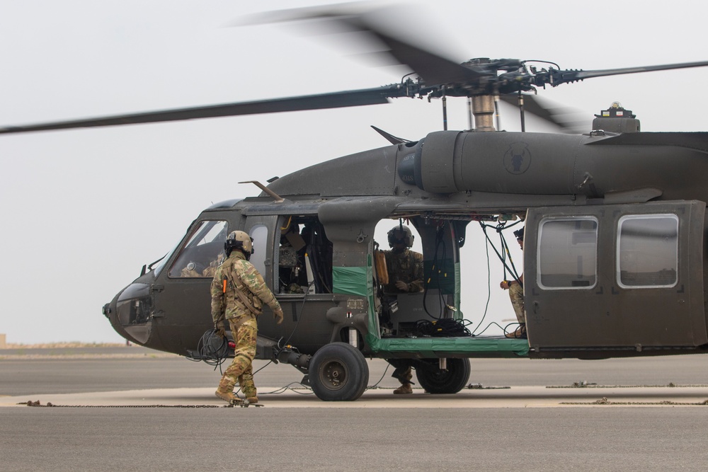 Task Force Spartan Soldiers rappel from Black Hawks during Rappel Master Course