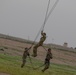 Task Force Spartan Soldiers rappel from Black Hawks during Rappel Master Course