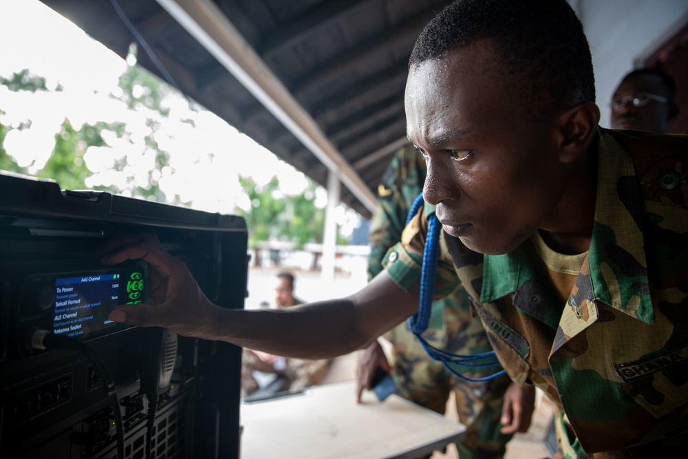 Ghanian, German, and American Signal Soldiers Discuss High Frequency Radio Capabilities