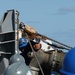 USS Thomas Hudner (DDG 116) hook up fuel lines during a replenishment at sea