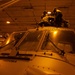 Sailors work on an MH-60S Nighthawk