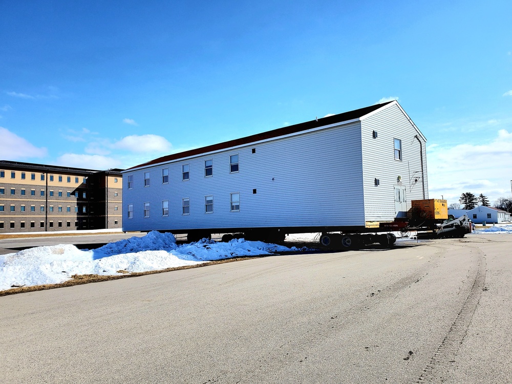 Contractors move second World War II-era barracks building at Fort McCoy