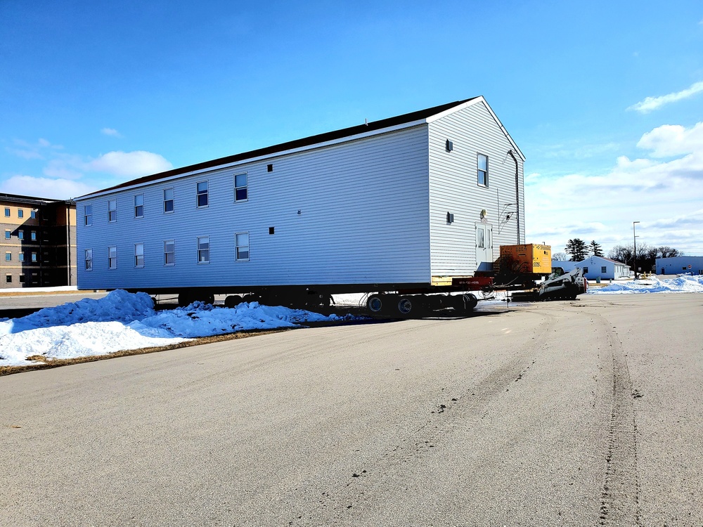 Contractors move second World War II-era barracks building at Fort McCoy