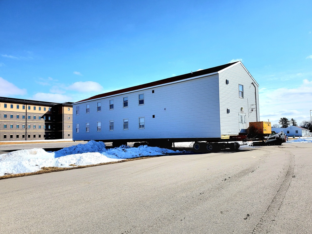 Contractors move second World War II-era barracks building at Fort McCoy