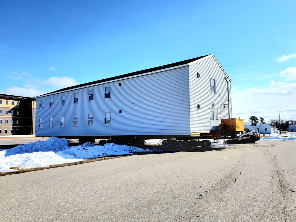 Contractors move second World War II-era barracks building at Fort McCoy