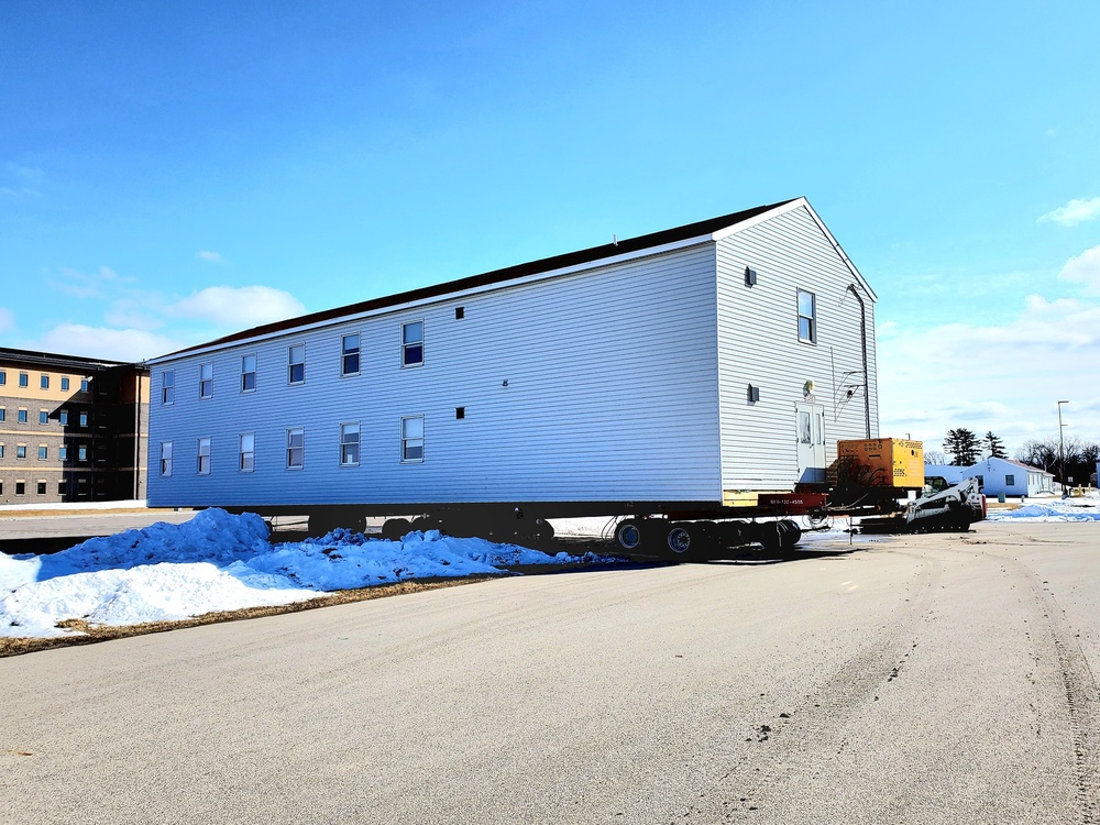 Contractors move second World War II-era barracks building at Fort McCoy