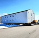 Contractors move second World War II-era barracks building at Fort McCoy