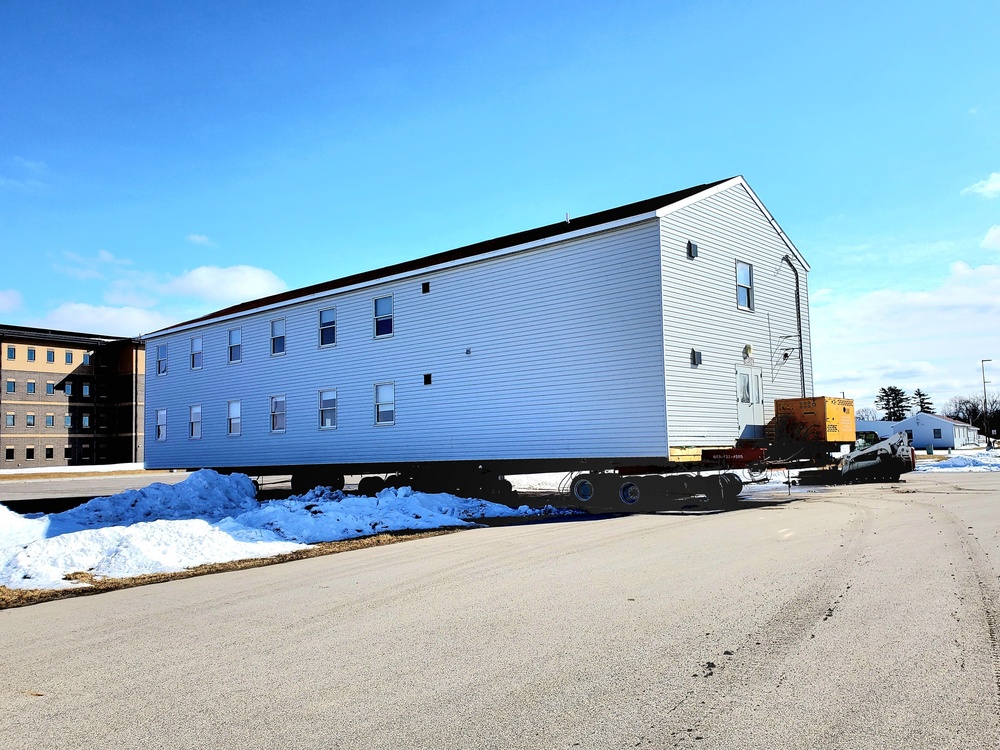 Contractors move second World War II-era barracks building at Fort McCoy