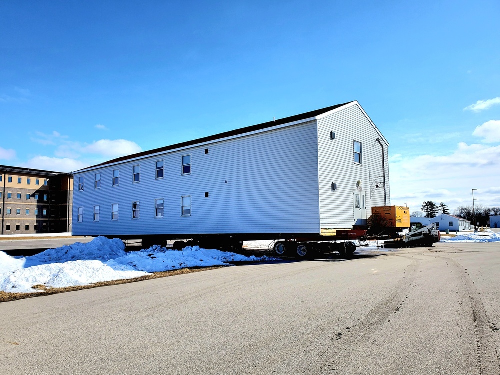 Contractors move second World War II-era barracks building at Fort McCoy