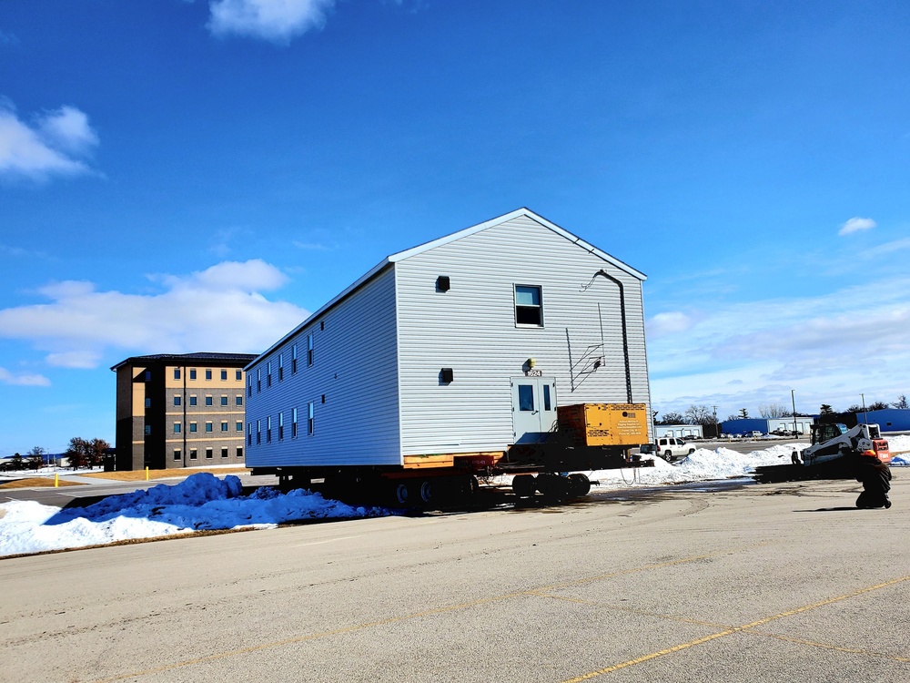 Contractors move second World War II-era barracks building at Fort McCoy