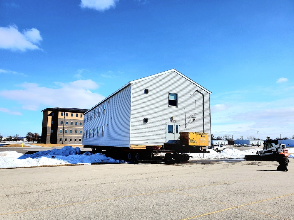 Contractors move second World War II-era barracks building at Fort McCoy