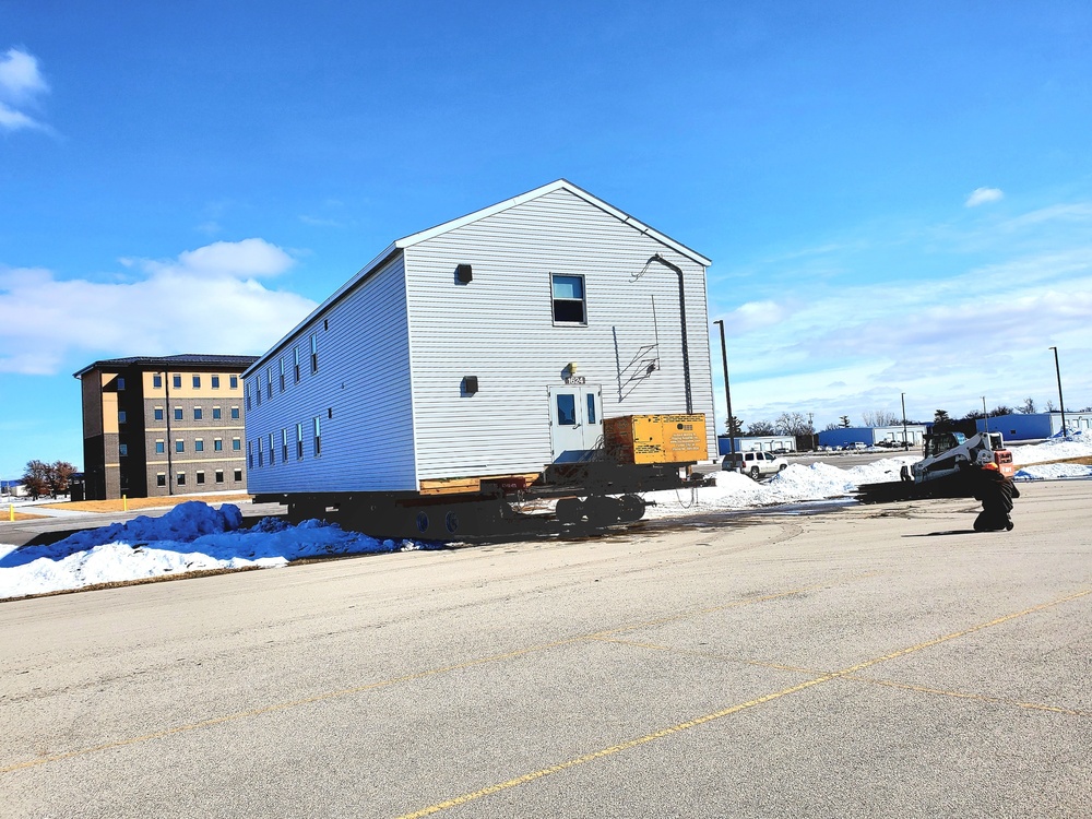 Contractors move second World War II-era barracks building at Fort McCoy