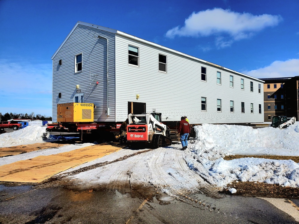 Contractors move second World War II-era barracks building at Fort McCoy