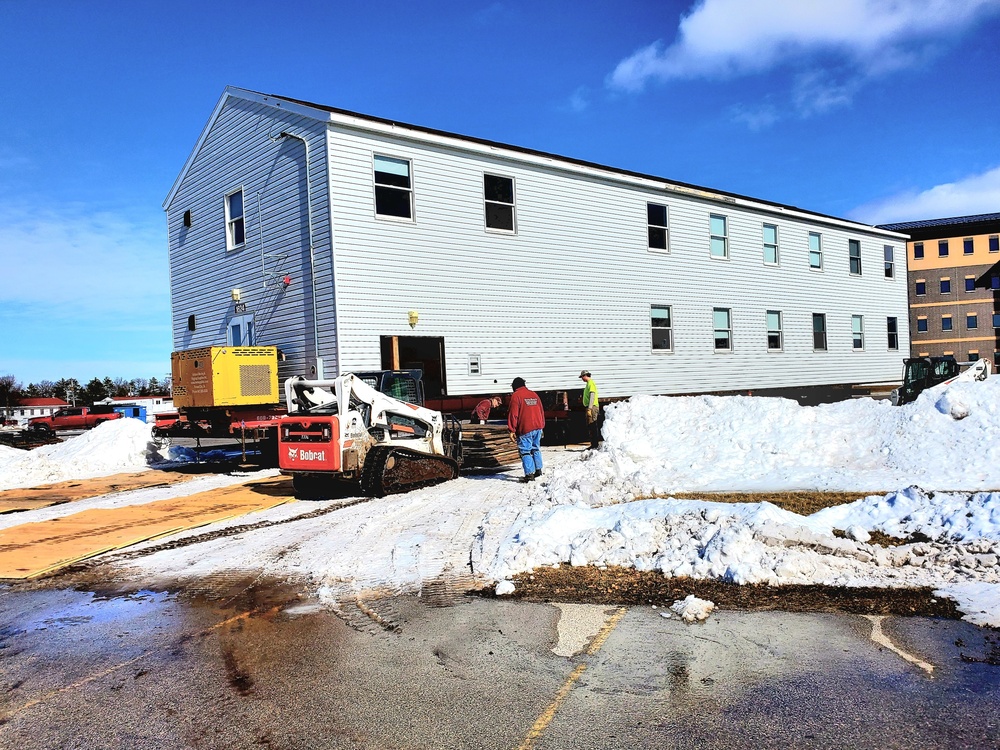 Contractors move second World War II-era barracks building at Fort McCoy