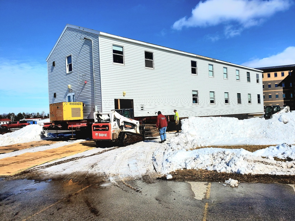 Contractors move second World War II-era barracks building at Fort McCoy