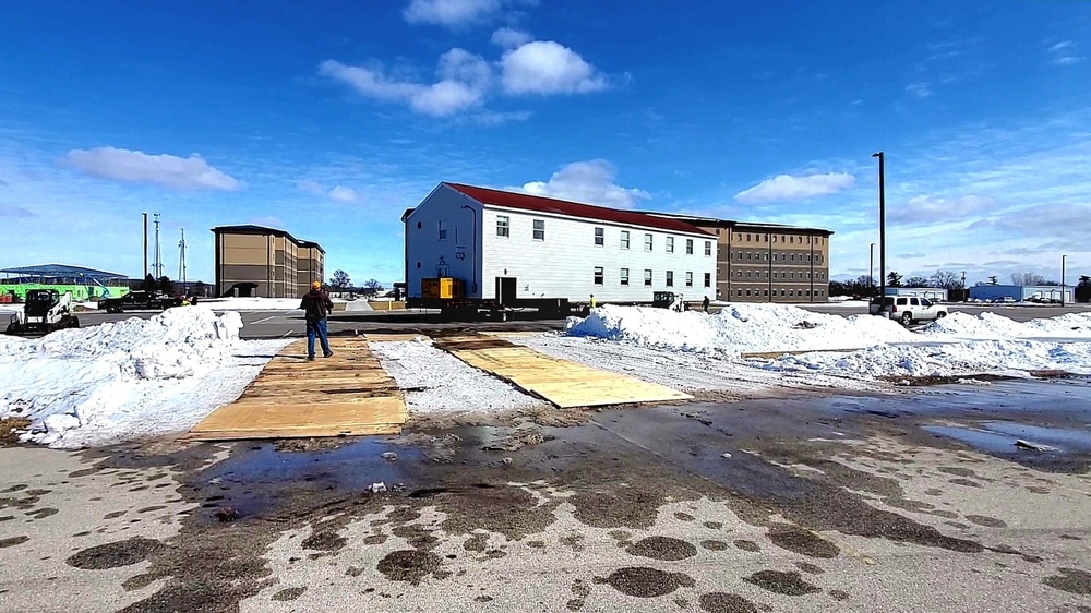 Contractors move second World War II-era barracks building at Fort McCoy