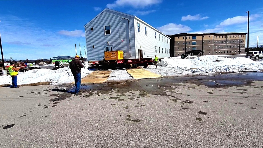 Contractors move second World War II-era barracks building at Fort McCoy