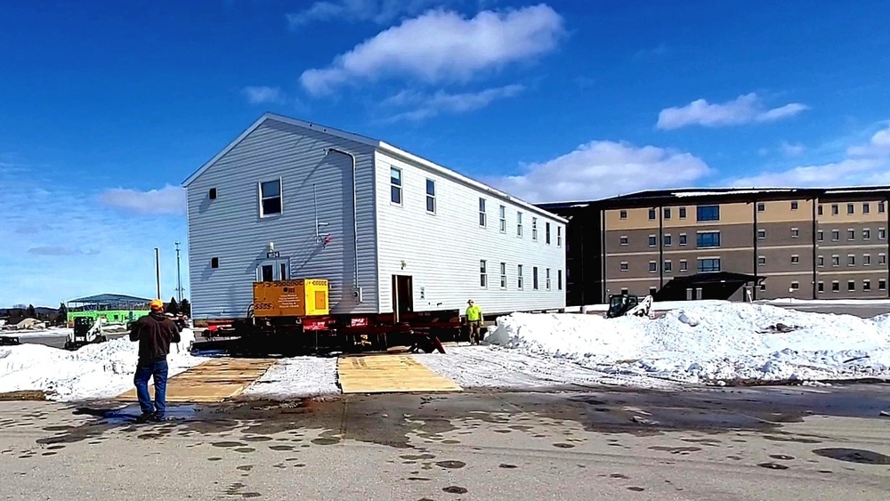 Contractors move second World War II-era barracks building at Fort McCoy