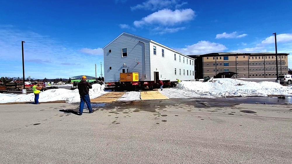 Contractors move second World War II-era barracks building at Fort McCoy