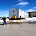 Contractors move second World War II-era barracks building at Fort McCoy