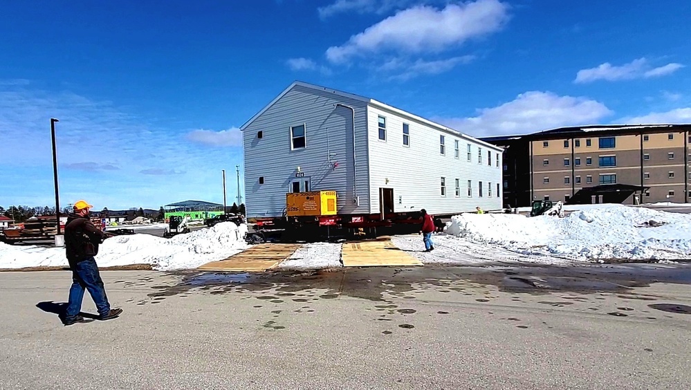 Contractors move second World War II-era barracks building at Fort McCoy