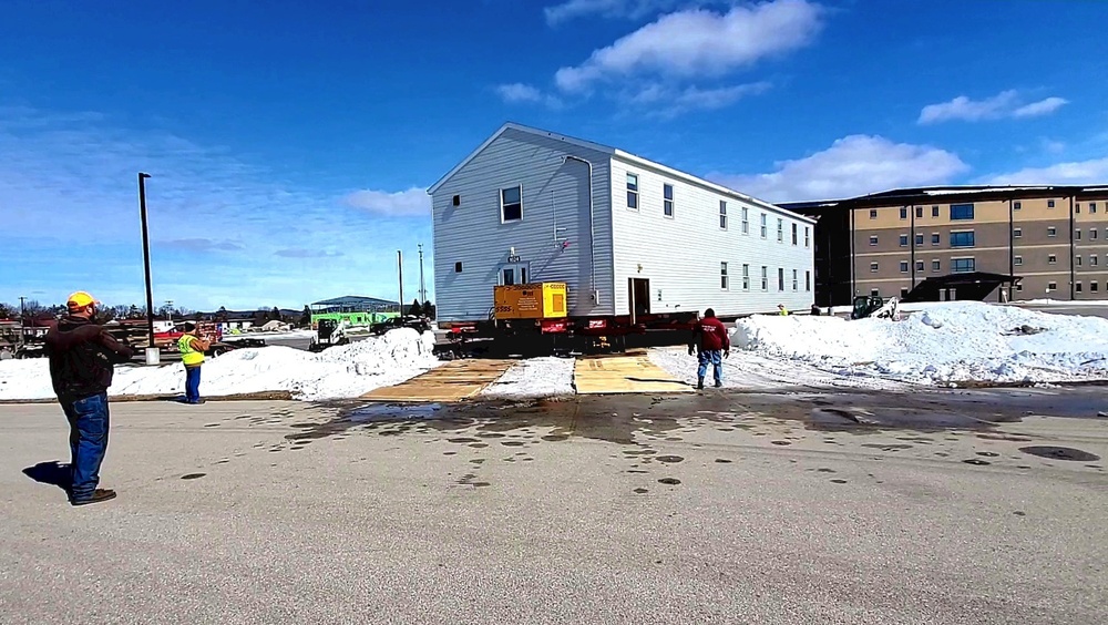 Contractors move second World War II-era barracks building at Fort McCoy