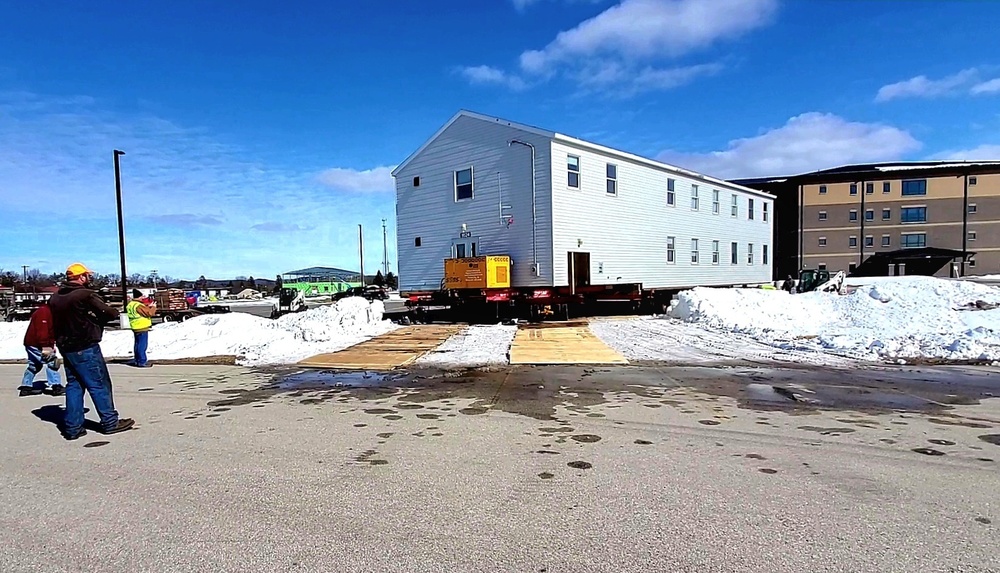 Contractors move second World War II-era barracks building at Fort McCoy