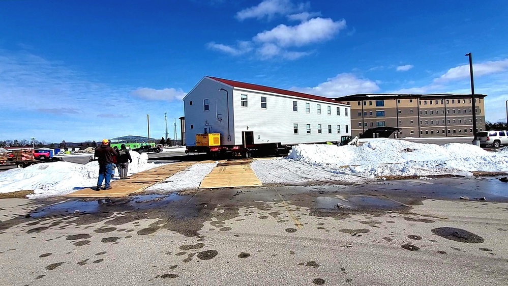 Contractors move second World War II-era barracks building at Fort McCoy